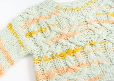 ETS international knitwear sample : A light green chunky knit sweater